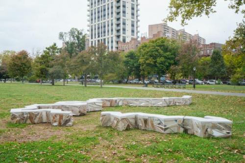 "UKR|RUS," 2024, reclaimed wood, concrete, glass, plaster, and ground marble, Asser Levy Park, Brooklyn, NY