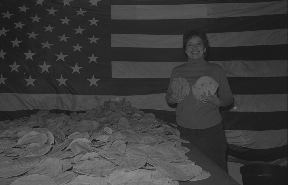 Artist Susan Plum during installation for Low Down Showdown, a group exhibtion in Tribeca, New York City, 1983